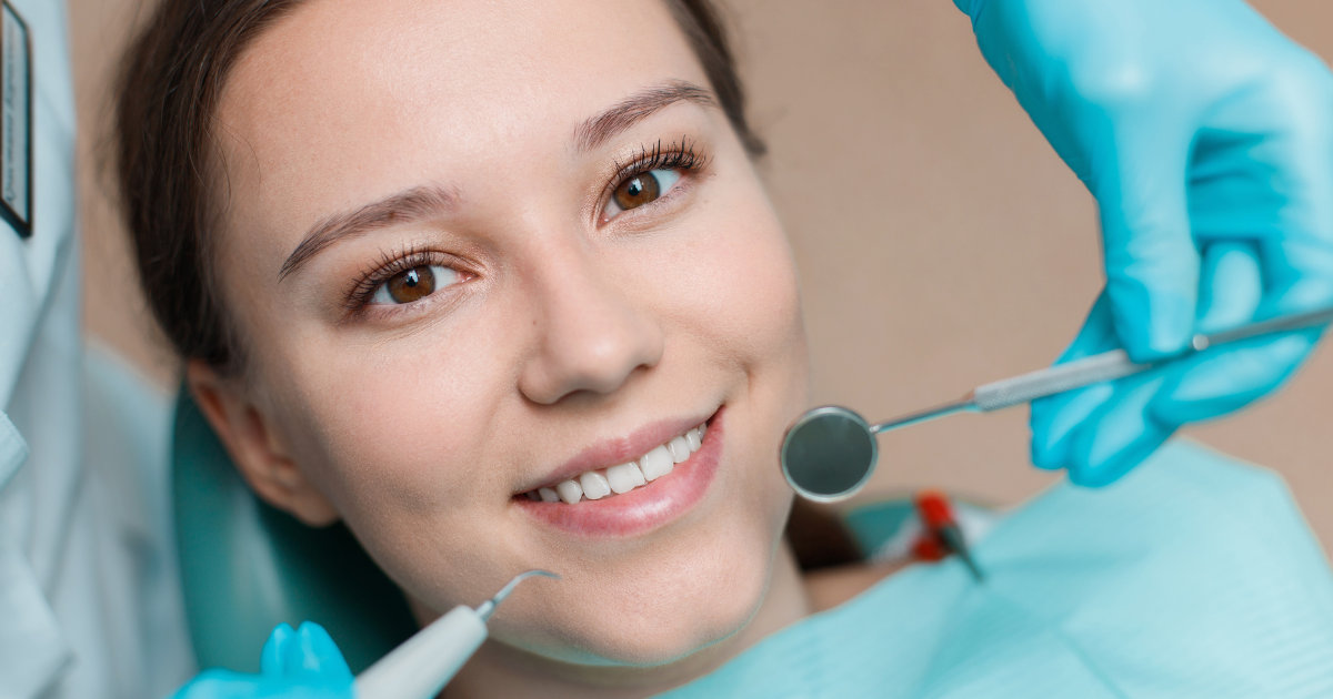 Dentist performing teeth cleaning and whitening treatments at Gravity Dental Polyclinic, Dubai