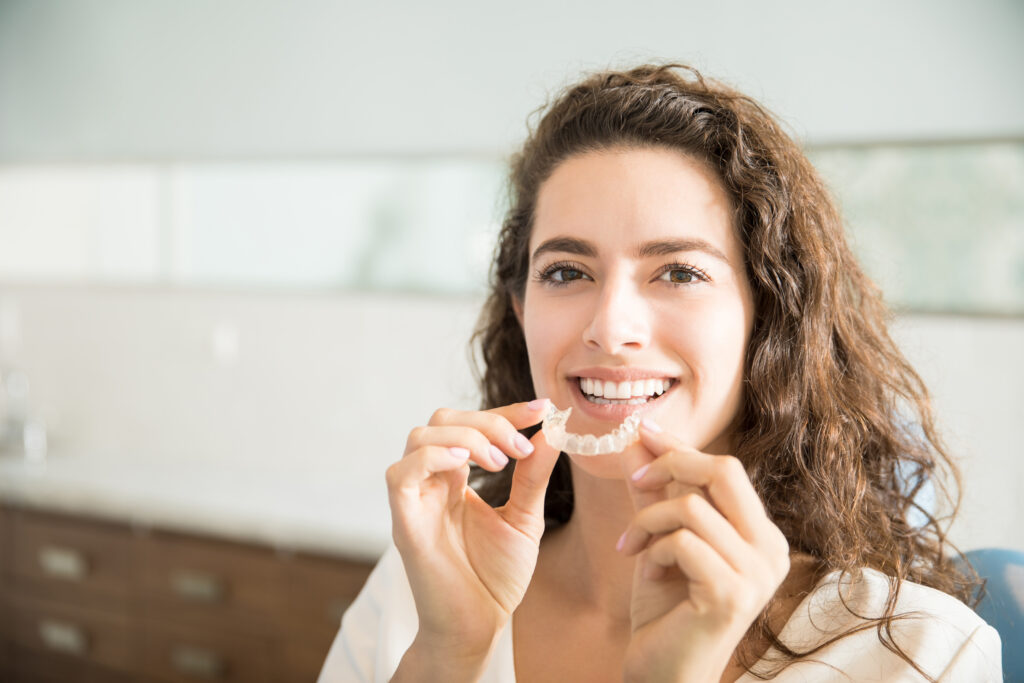 Invisalign aligners placed on dental model with overbite correction