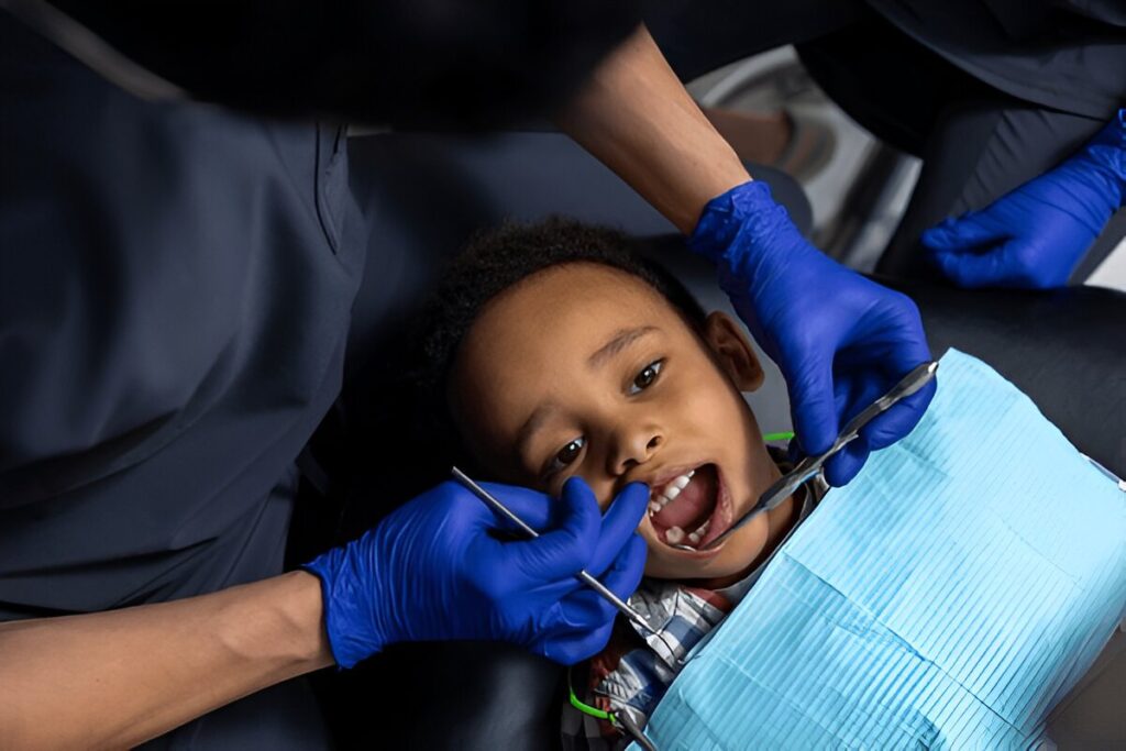 Child smiling during first pediatric dental visit