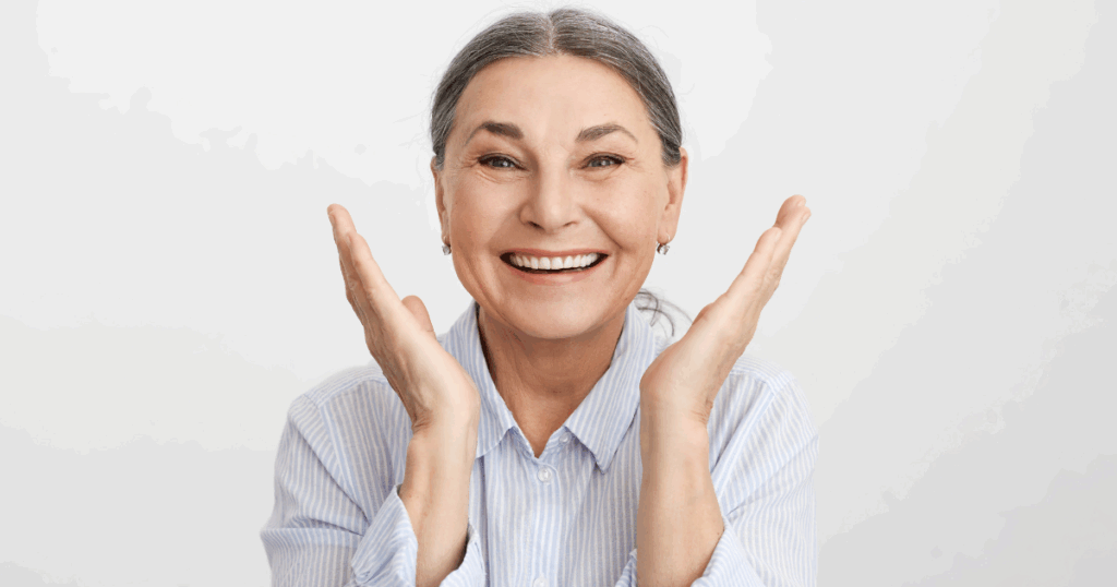 Older adult smiling after dental checkup showing strong oral and overall health connection