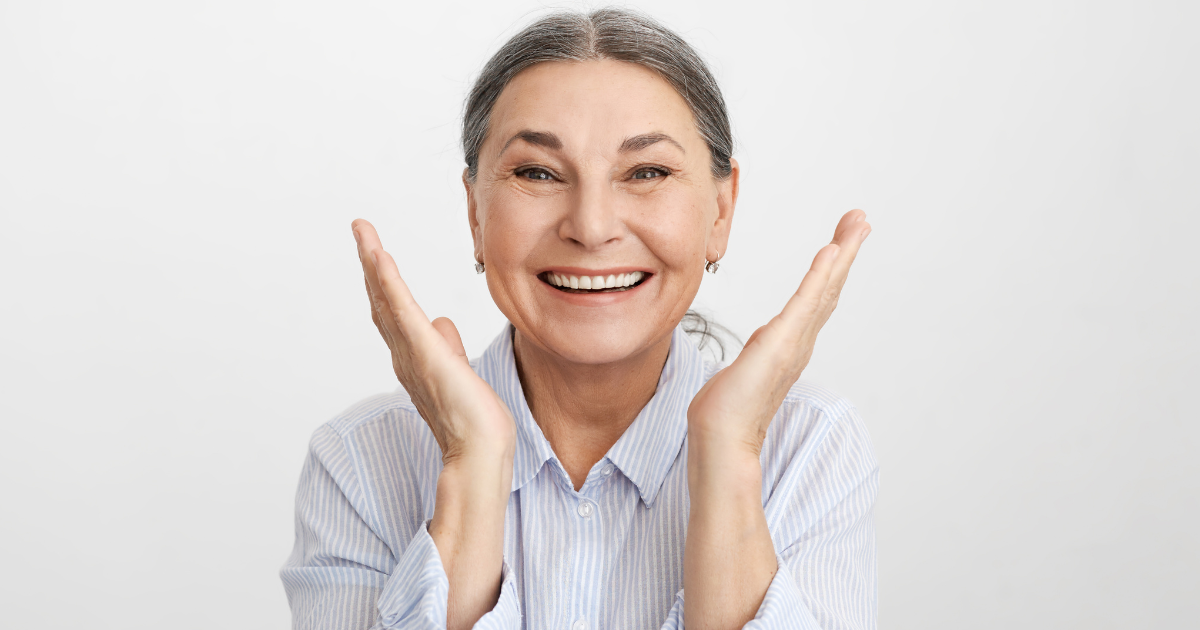 Older adult smiling after dental checkup showing strong oral and overall health connection