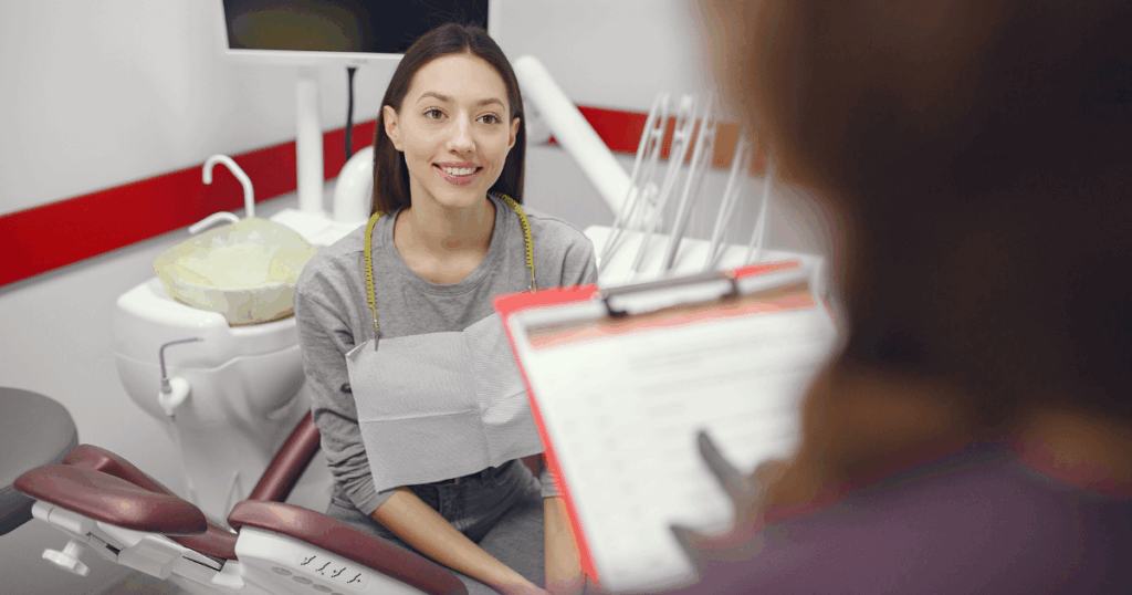 Patient talking to a dentist during a dental visit
