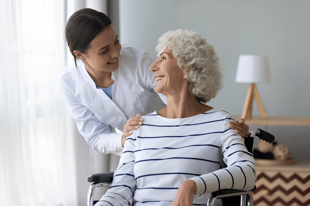 Dentist assisting an elderly Alzheimer’s patient with gentle oral care at Gravity Dental