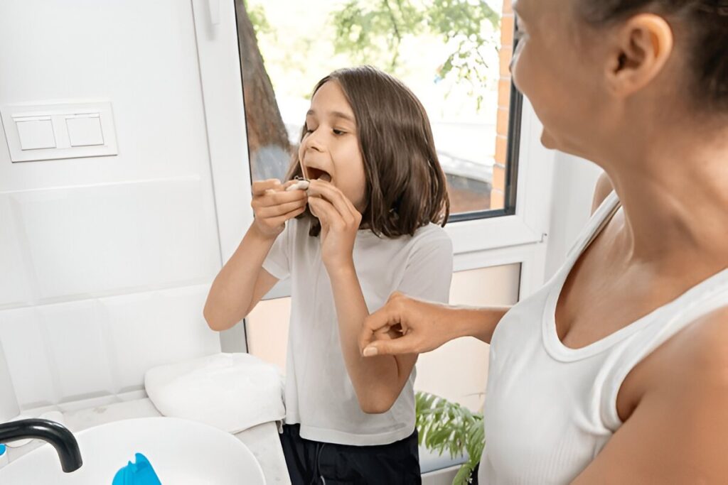 Child smiling during first orthodontic visit at Gravity Dental Dubai