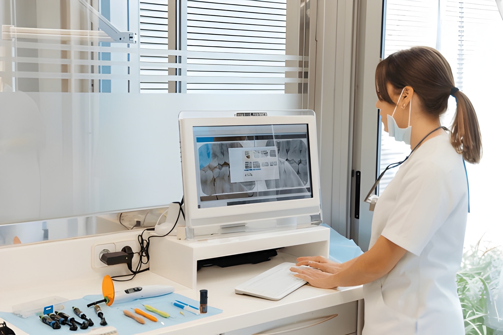 Dentist performing an oral cancer screening on a patient at Gravity Dental Polyclinic Dubai