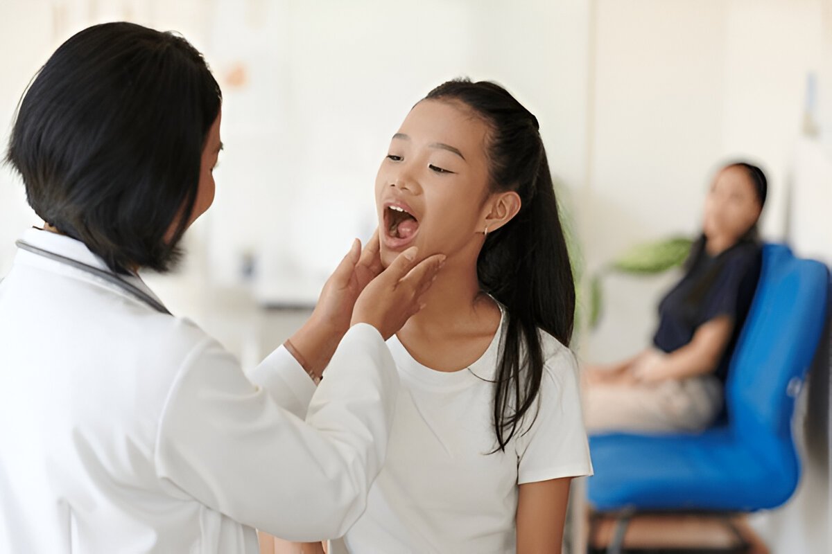 Patient with autoimmune disease receiving dental care to manage dry mouth, gum inflammation, and oral health symptoms