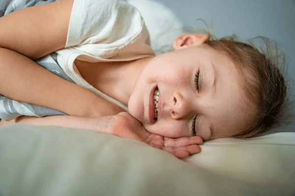Child grinding teeth while sleeping — pediatric bruxism treatment at Gravity Dental Dubai