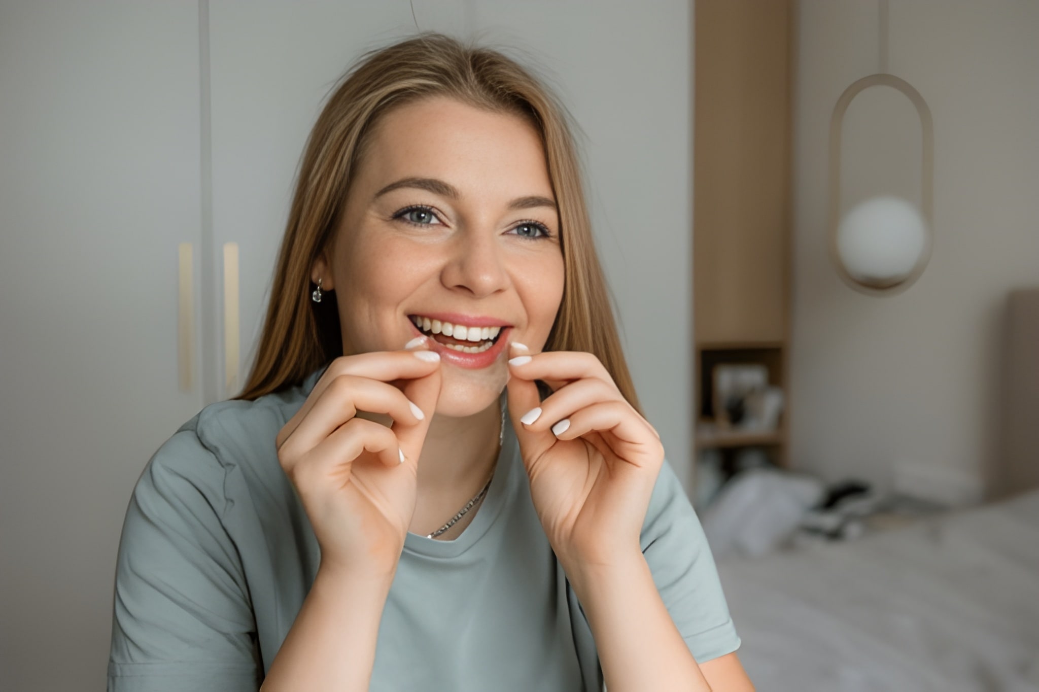 Patient using at-home orthodontic aligner safely