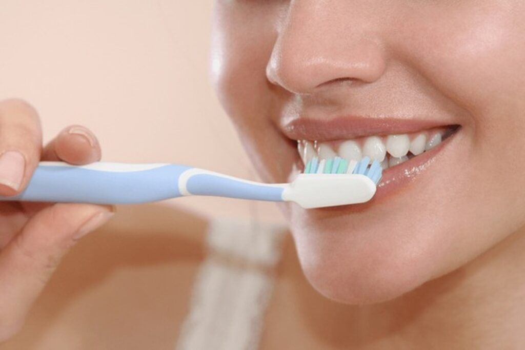 Soft toothbrush with gentle brushing technique to protect gums and enamel.